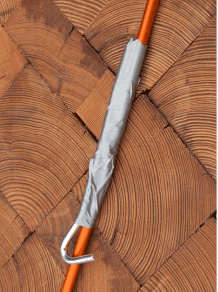 orange tent pole with a tent peg splint.covered with grey duct tape